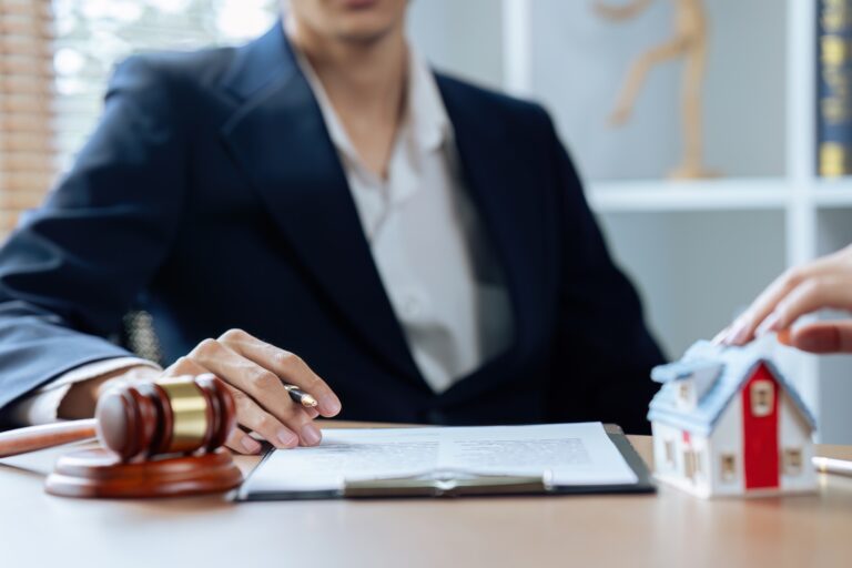 Home loan insurance, Male lawyer or judge Consult with client and working with Law books